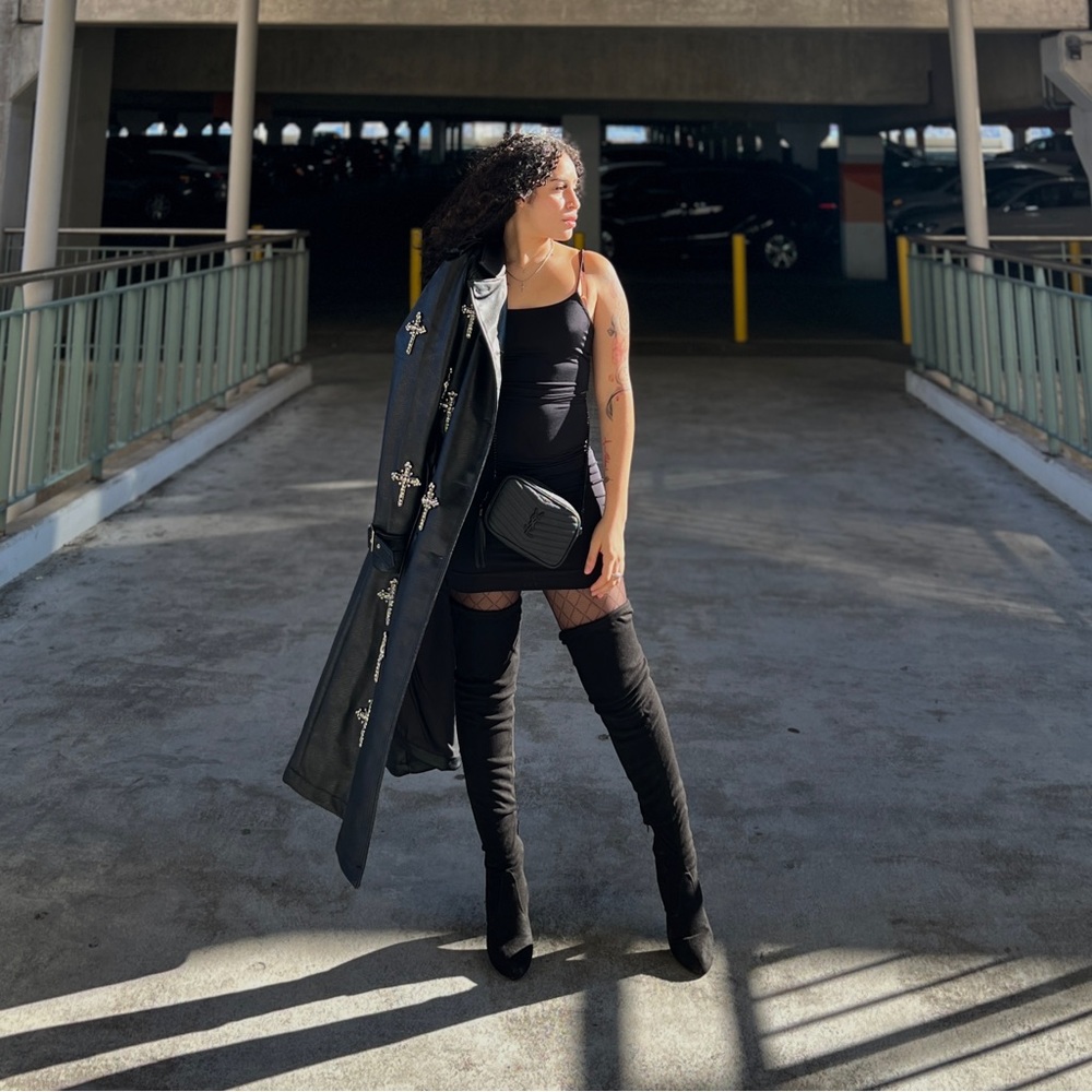 A black ling leather heavy jacket with rhinestone crosses